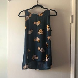 Blue sleeveless top with yellow and white flowers